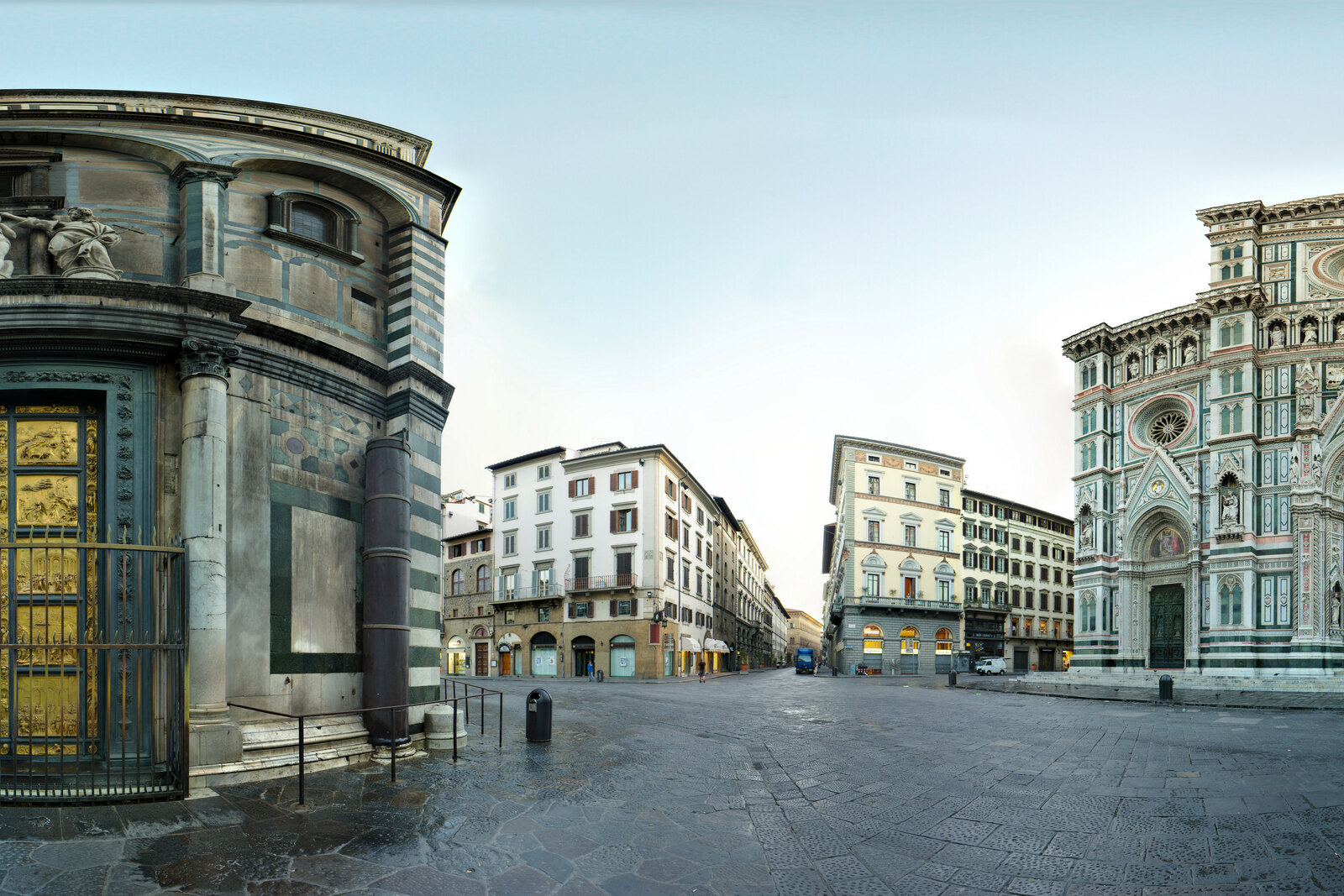 Panoramic view of Piazza del Duomo with the baptistery and the cathedral facade.
