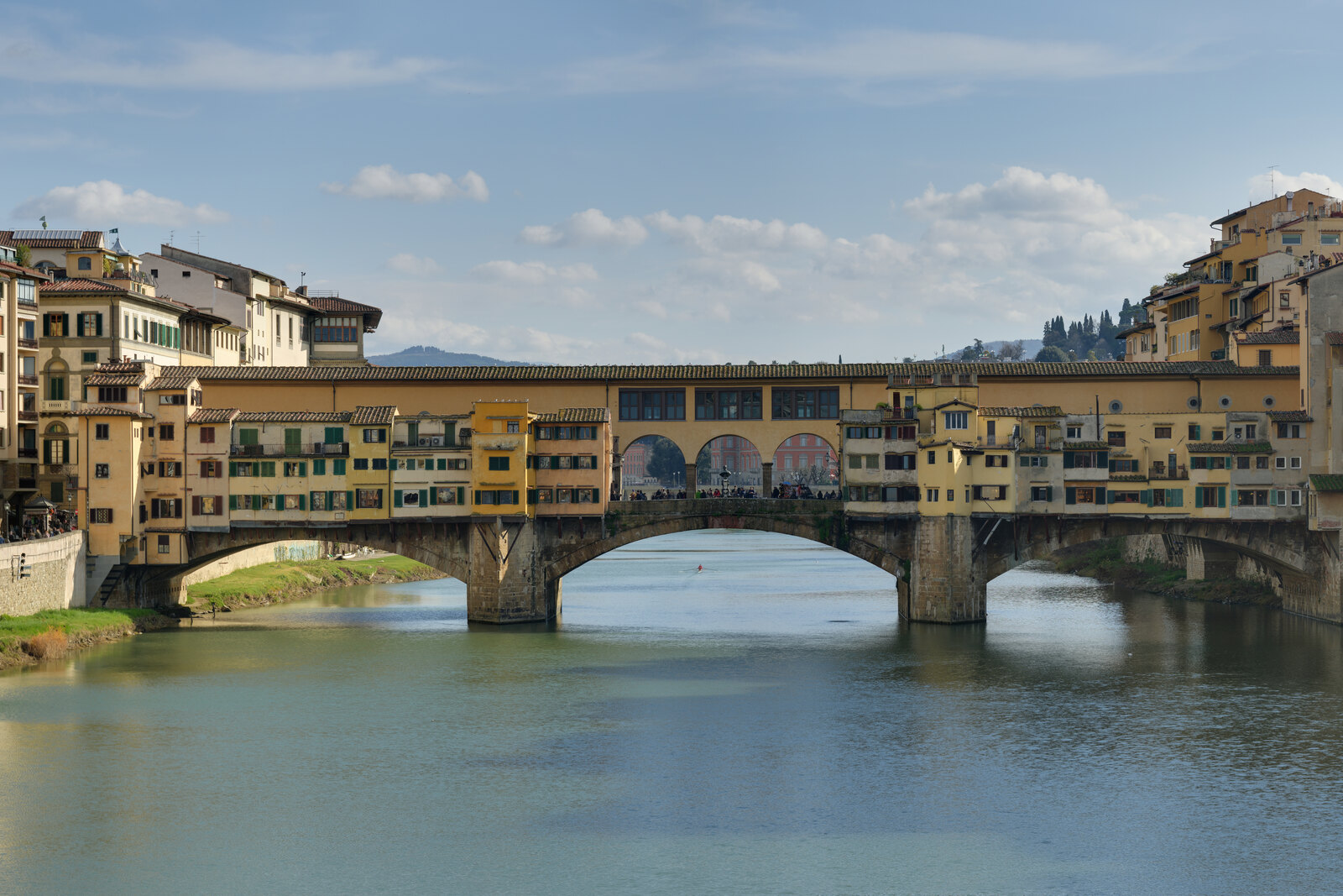 Ponte Vecchio in Florence over the Arno, viewed from the side.