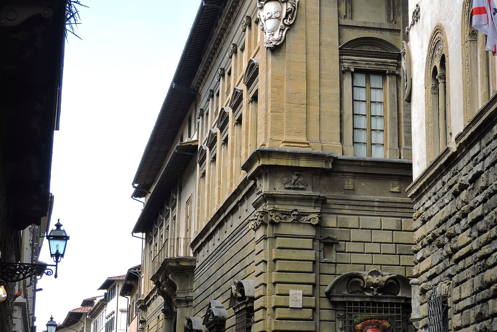 A large stone palace with arches on a narrow street—the Palazzo Nonfinito on Via del Proconsolo.