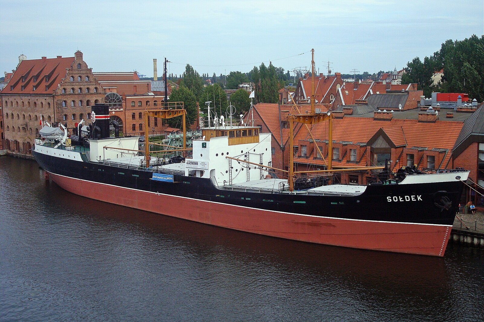 The black museum ship Sołdek moored at Ołowianka.