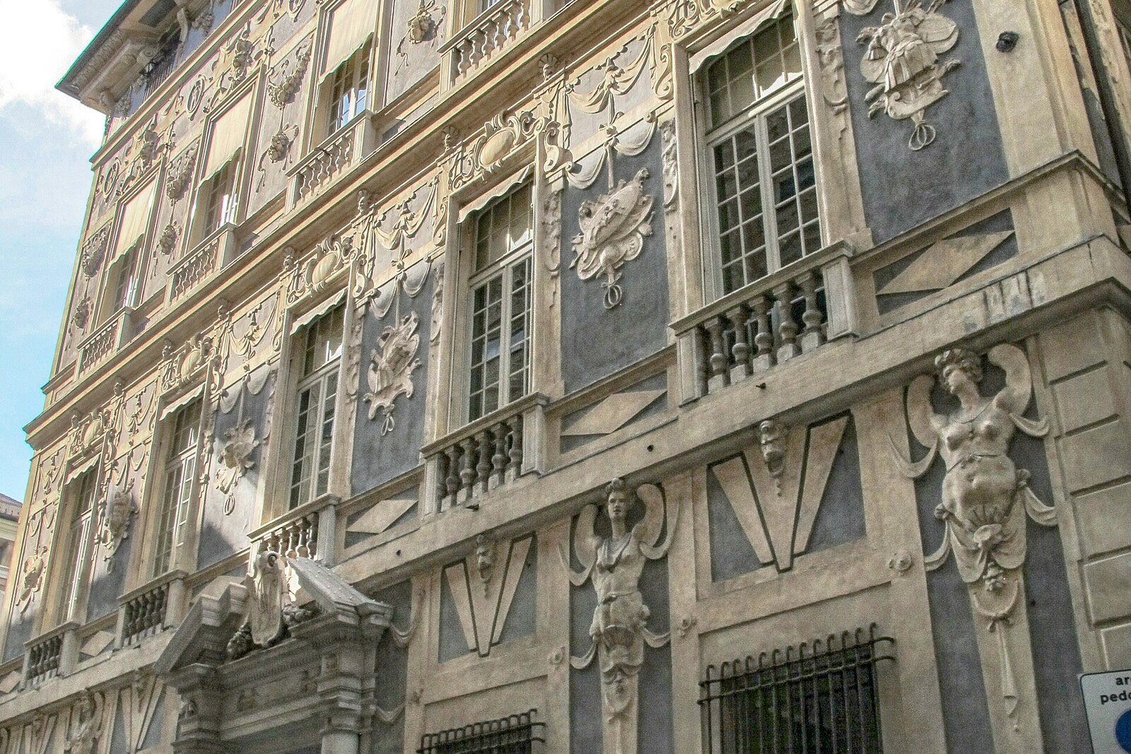 White stucco facade of Palazzo Nicolosio Lomellino.
