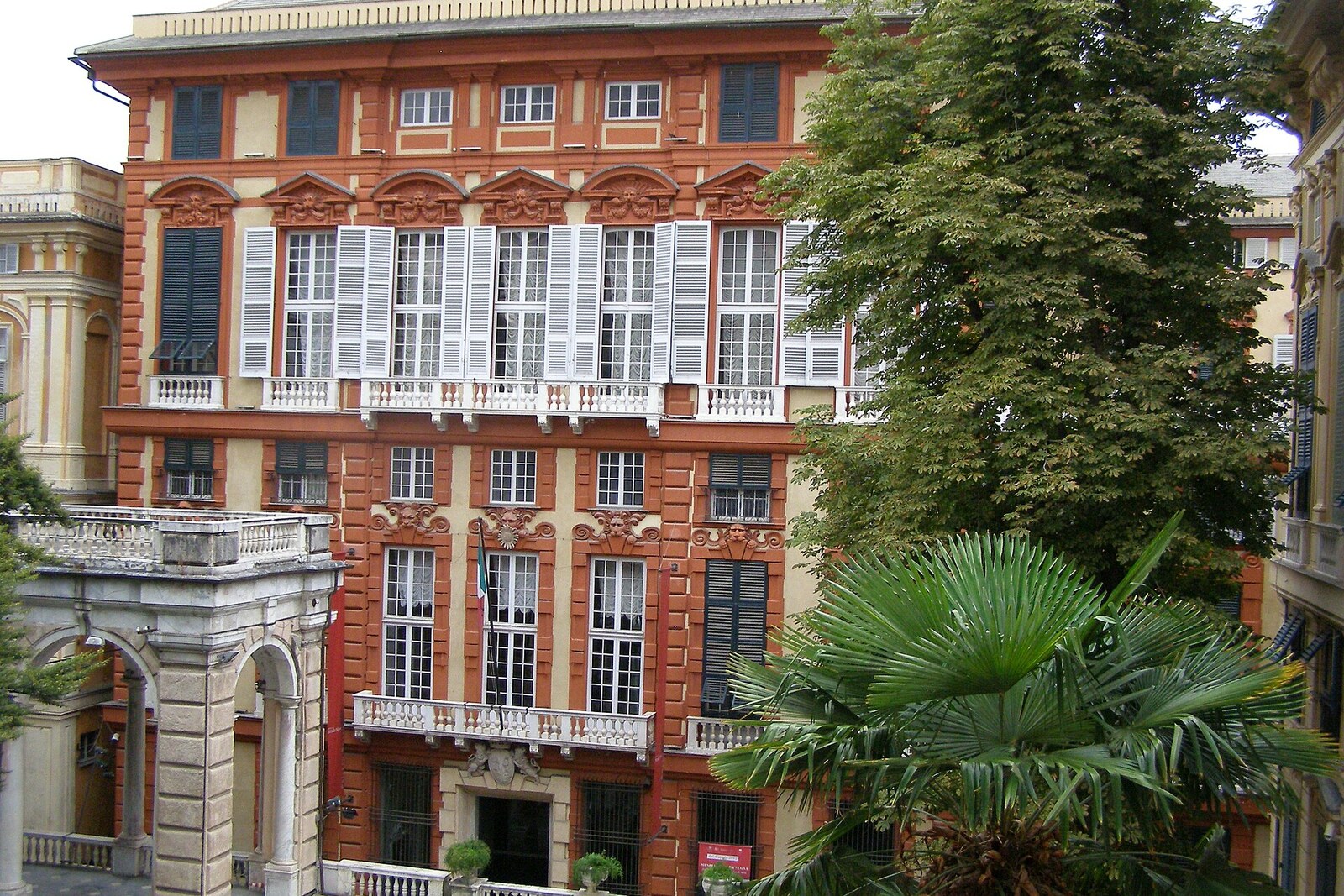 The red facade of Palazzo Rosso on Via Garibaldi.