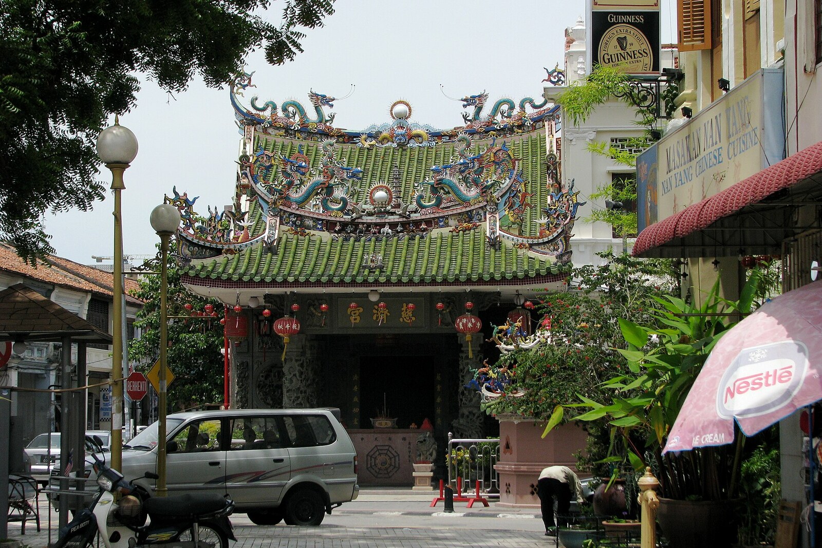 Facade of Yap Kongsi and Choo Chay Keong, with an ornate roof and gate in George Town.