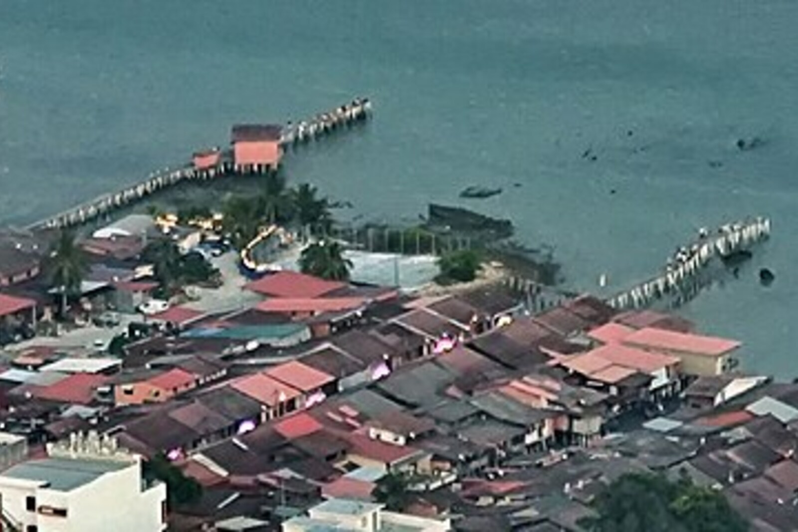 Contextual view of Penang's Clan Jetties with wooden houses over the water