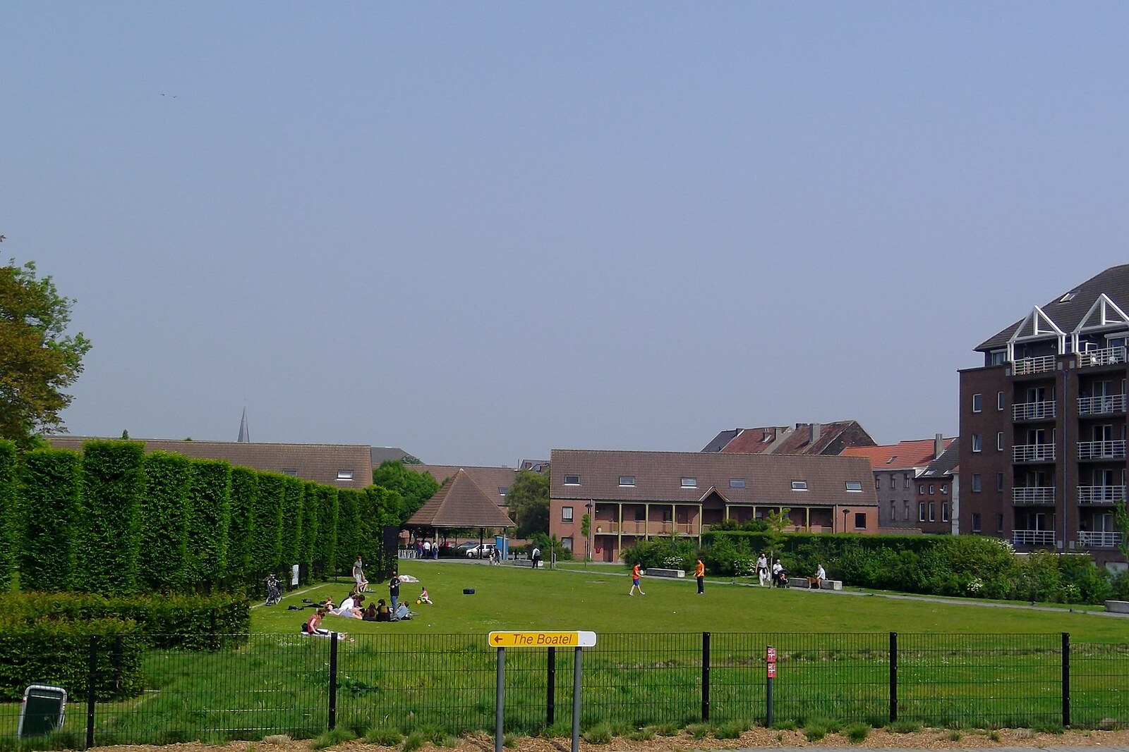 An open lawn in Coyendanspark beside Saint Bavo's Abbey in Ghent.
