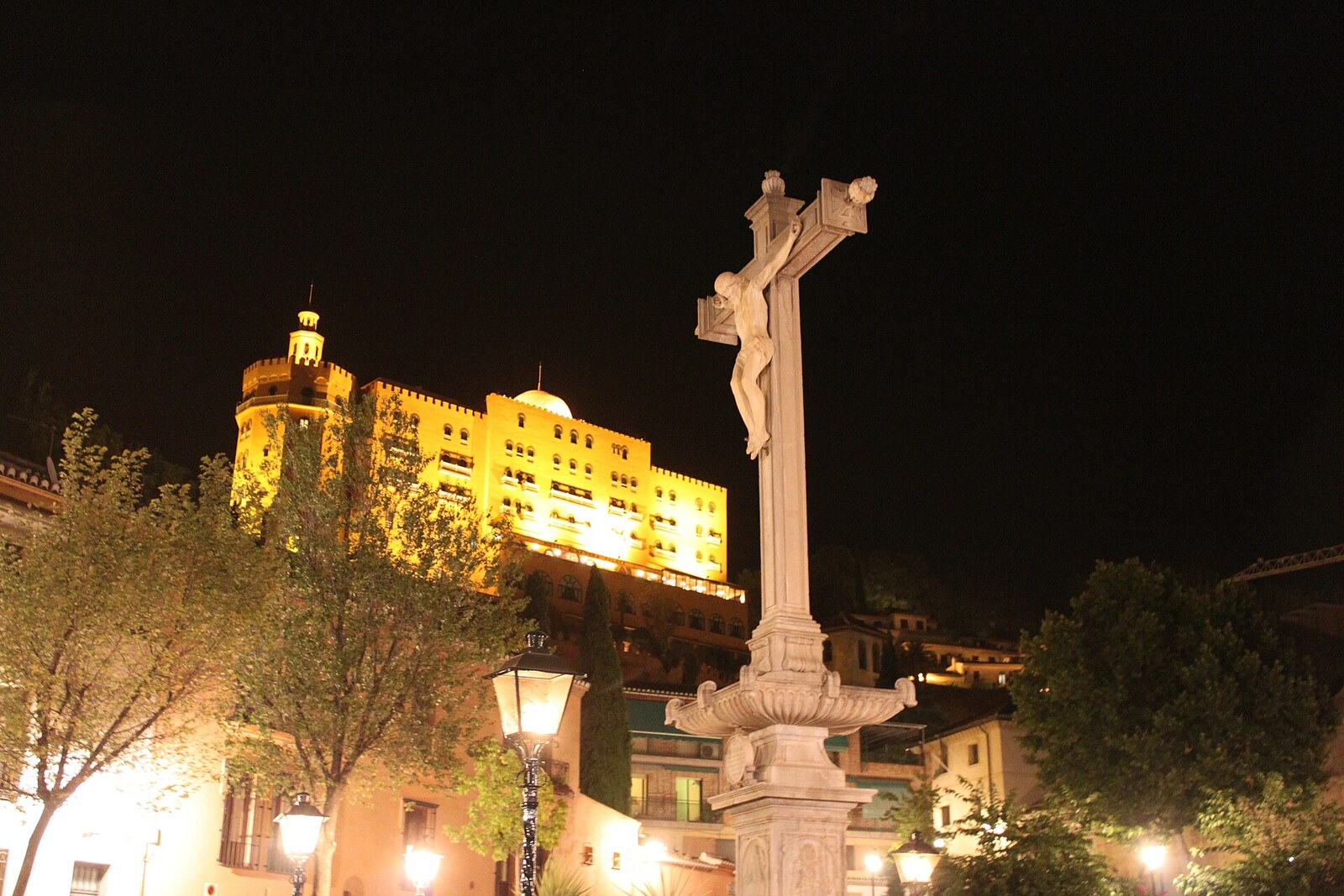 The stone cross of Cristo de los Favores in Campo del Príncipe square in Granada.
