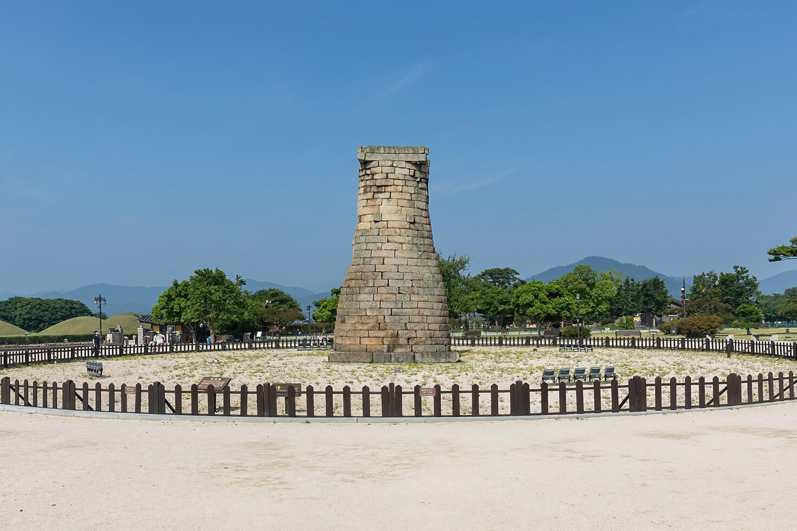 The stone tower of Cheomseongdae on an open lawn.