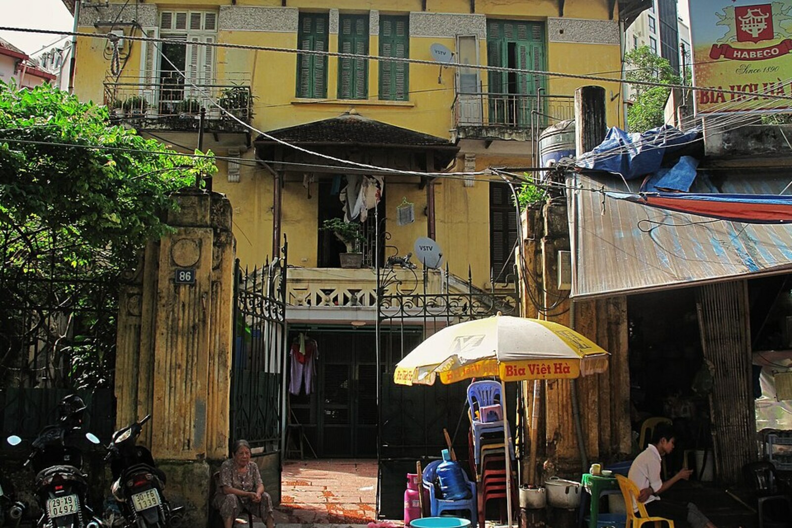 An old French façade and street life in the quarter near Nha Tho; a contextual view, not an exact address on Nha Tho Street.