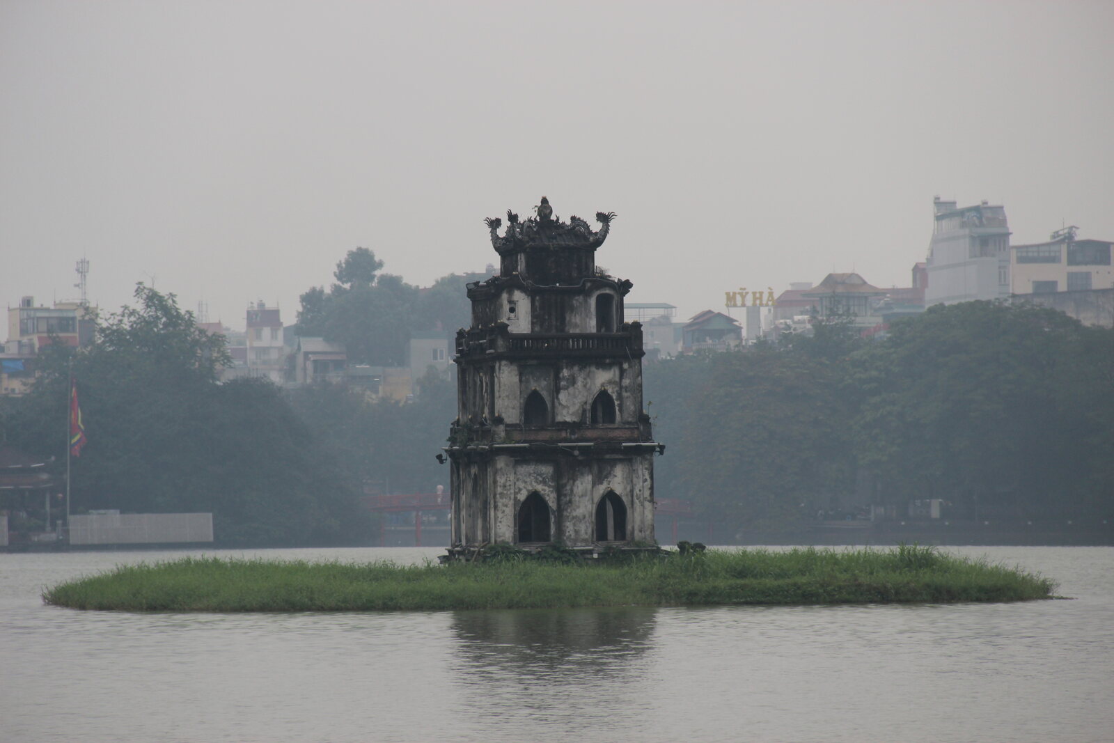 Turtle Tower stands out in isolation on the waters of Hoan Kiem Lake.