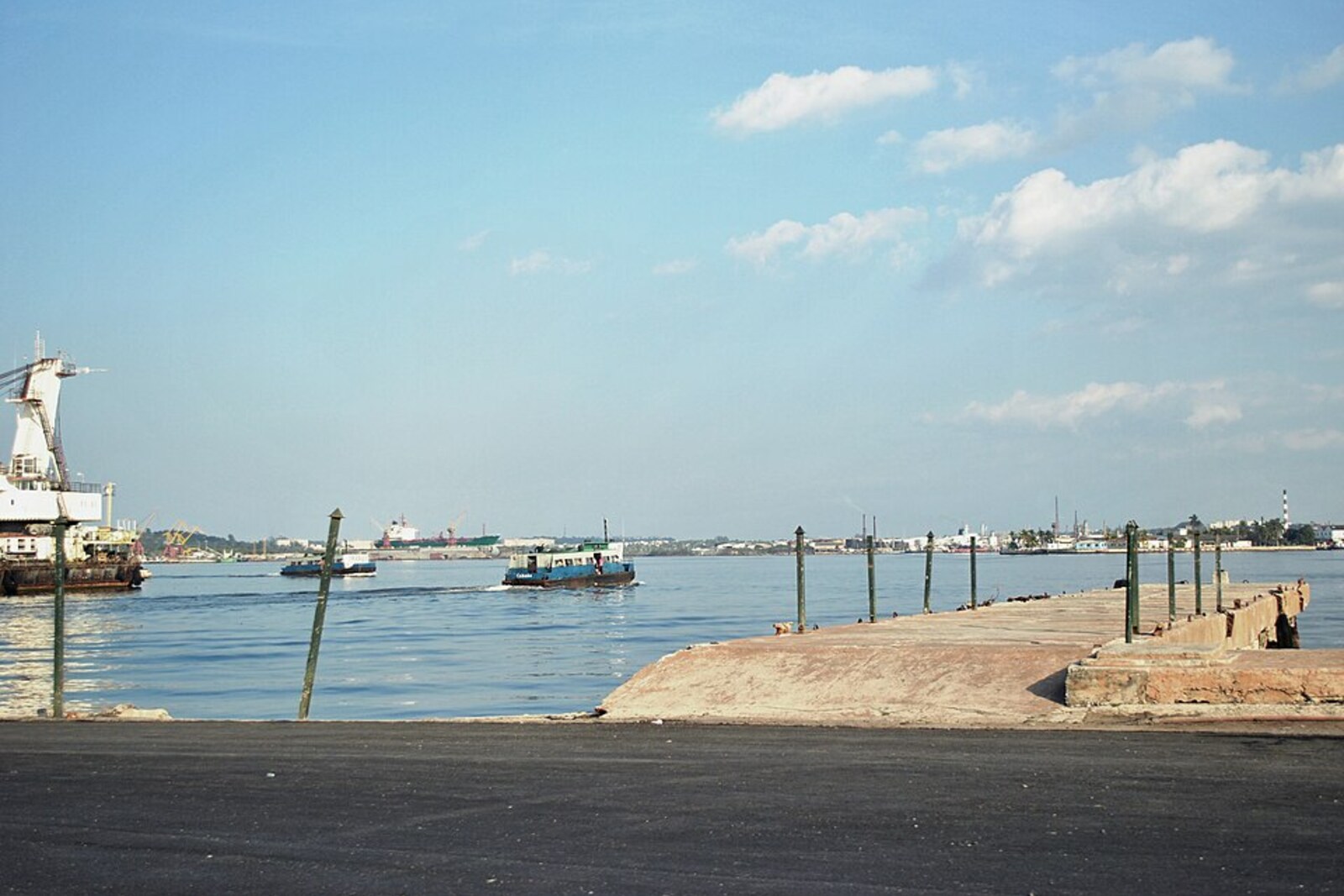A white passenger ferry bearing the inscription ‘Regla’ on blue water