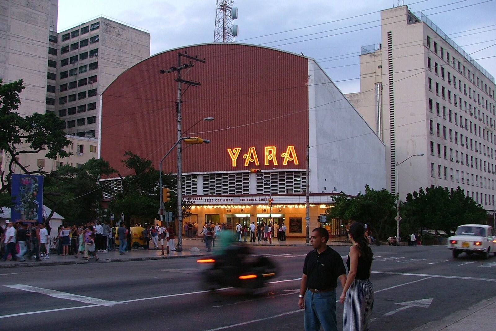 Yara Cinema at the corner of 23rd Street and L Street, with a red neon sign and a curved roof.