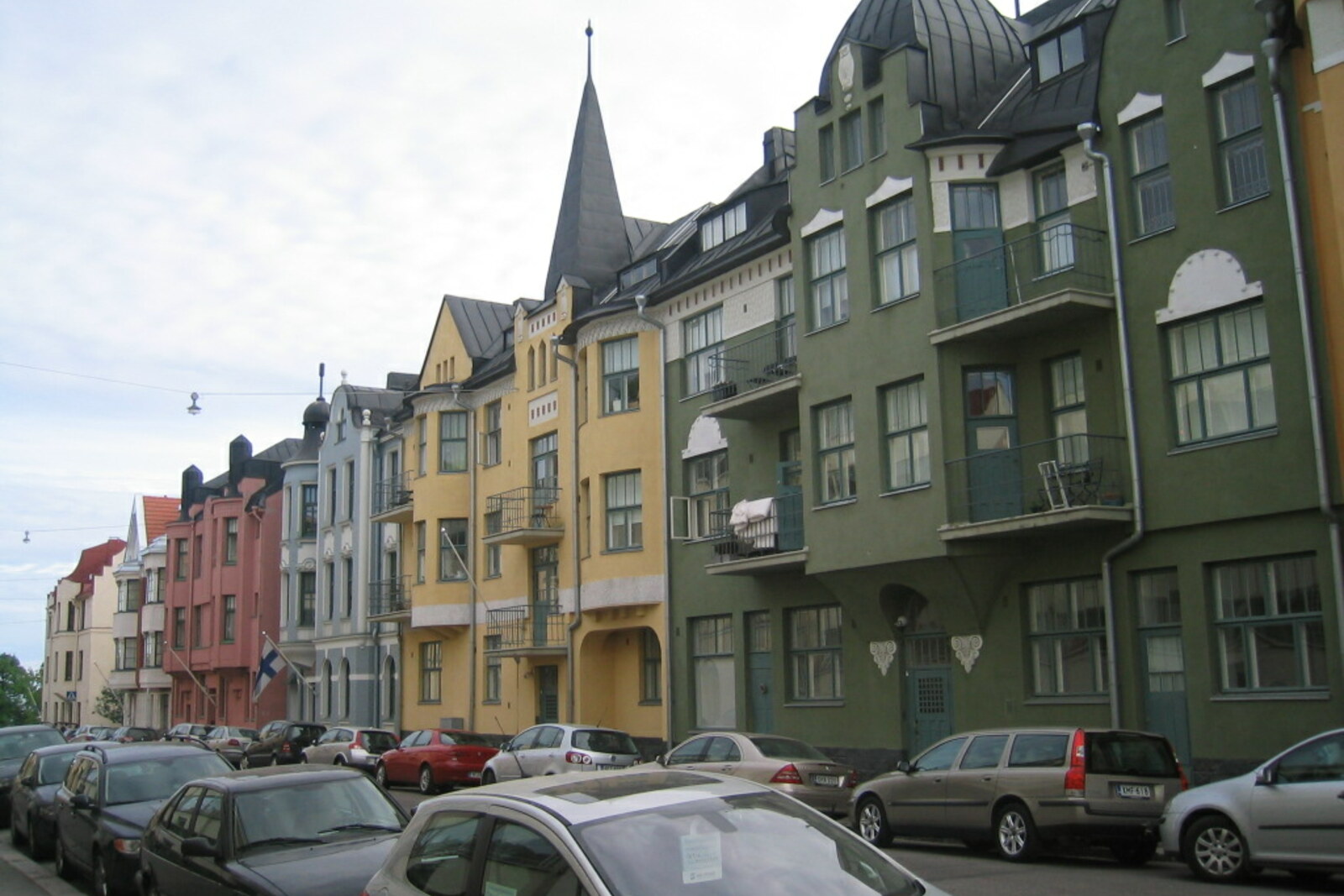Colorful house façades on the quiet street of Huvilakatu in Helsinki