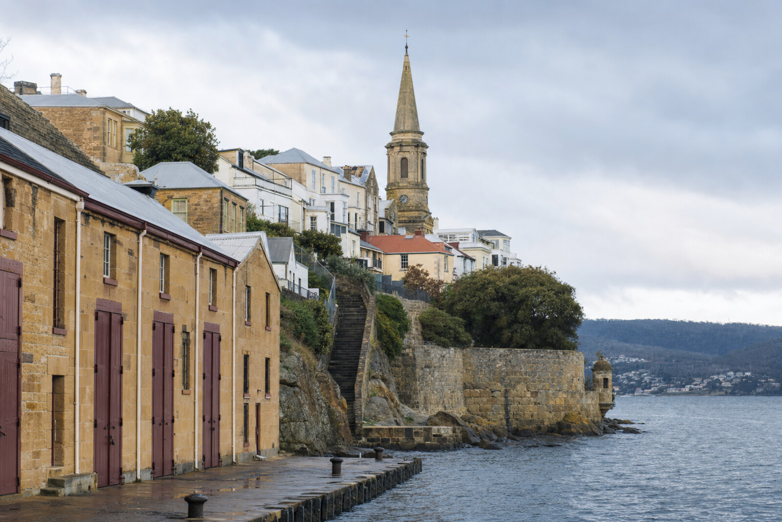 A sandstone warehouse, a stone staircase, a church tower, and a coastal battery above the River Derwent.