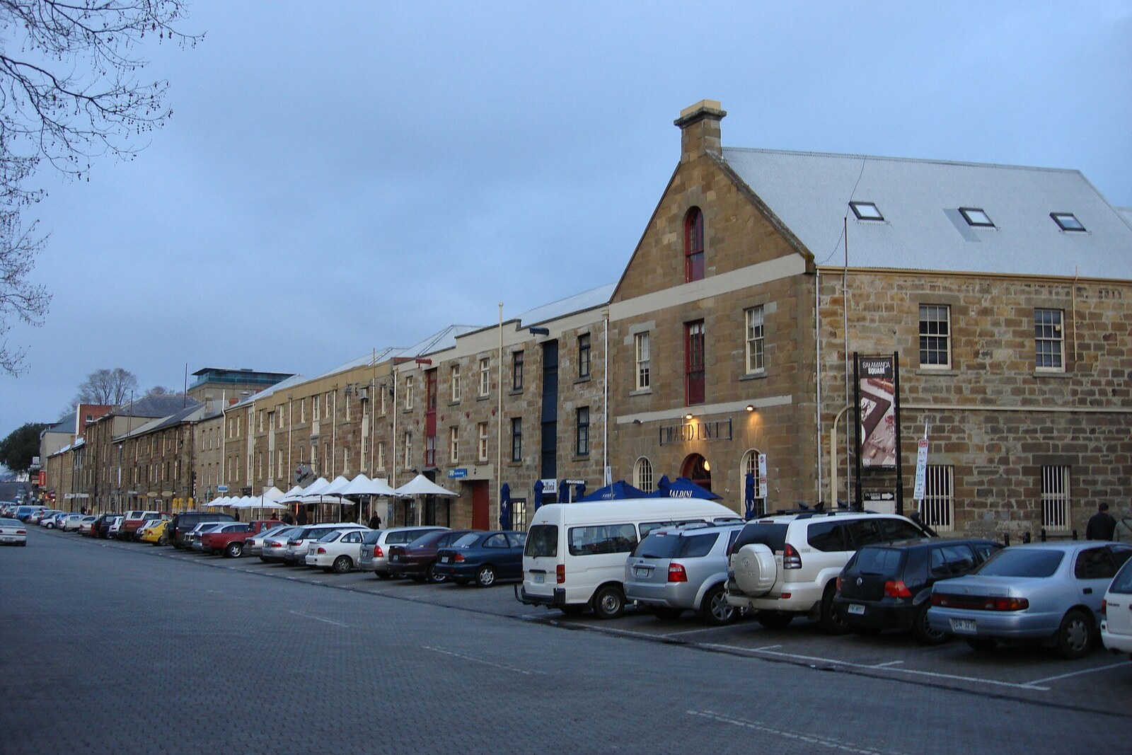 A row of former sandstone warehouses on Salamanca Place.