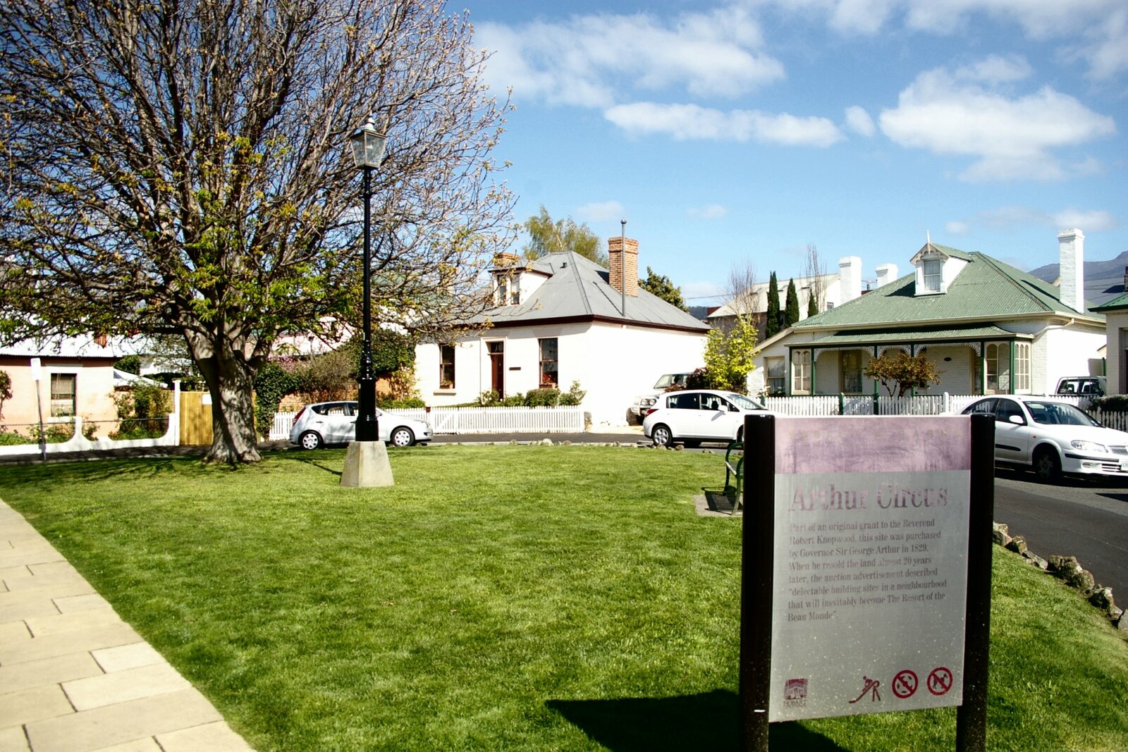 Low cottages around the green circle of Arthur Circus.