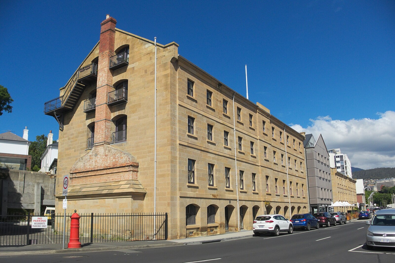 The long sandstone building of the former artillery storehouse beside Princes Park.