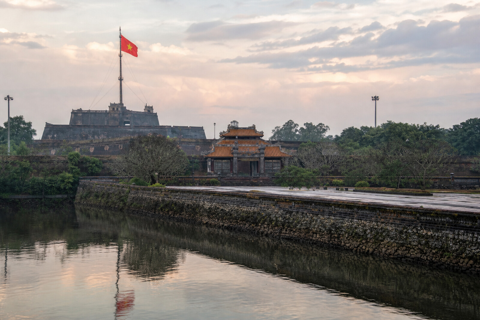 The Perfume River, the Flag Tower, and the walls and roofs of Noon Gate along the strict axis of Hue Citadel