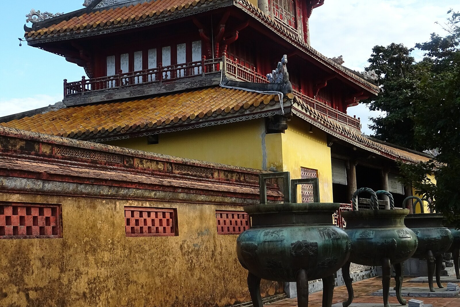Hien Lam Pavilion behind a row of large bronze urns