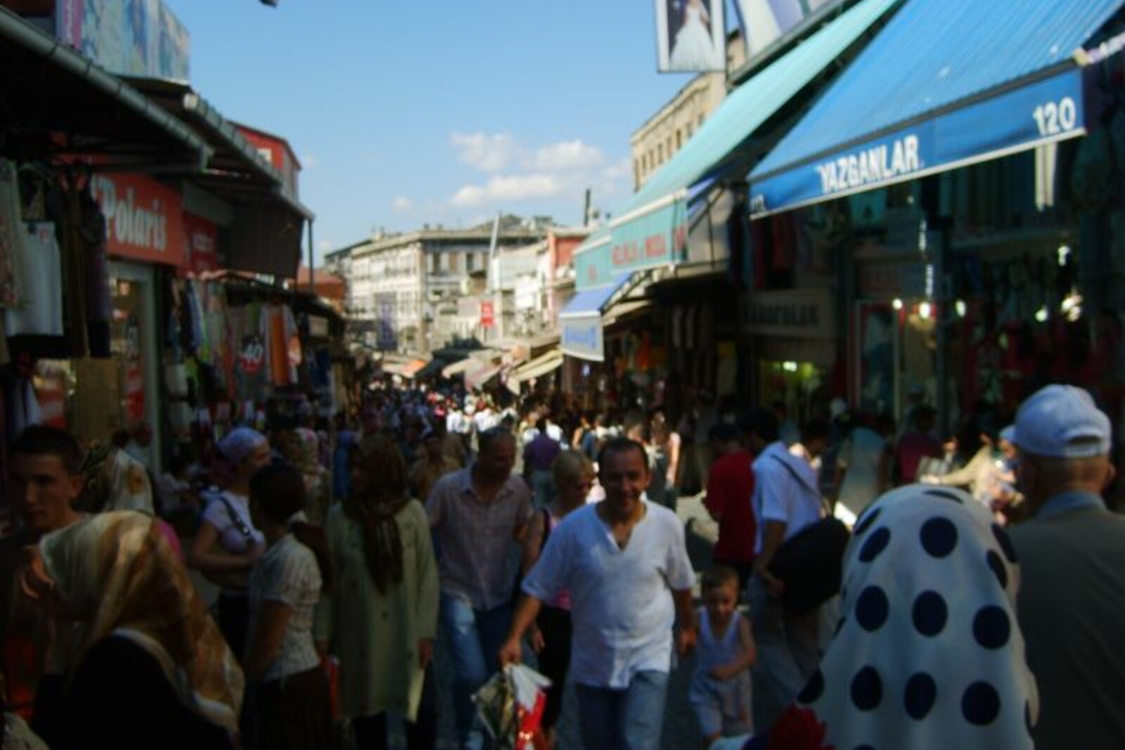 Mahmutpaşa Street with shops and hanging fabrics