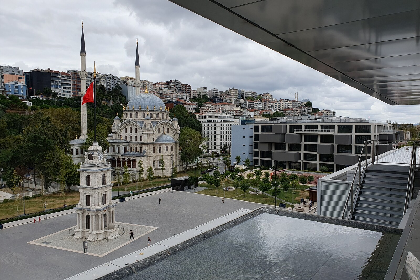 Galataport waterfront with a clock tower, mosque, and museum in the background