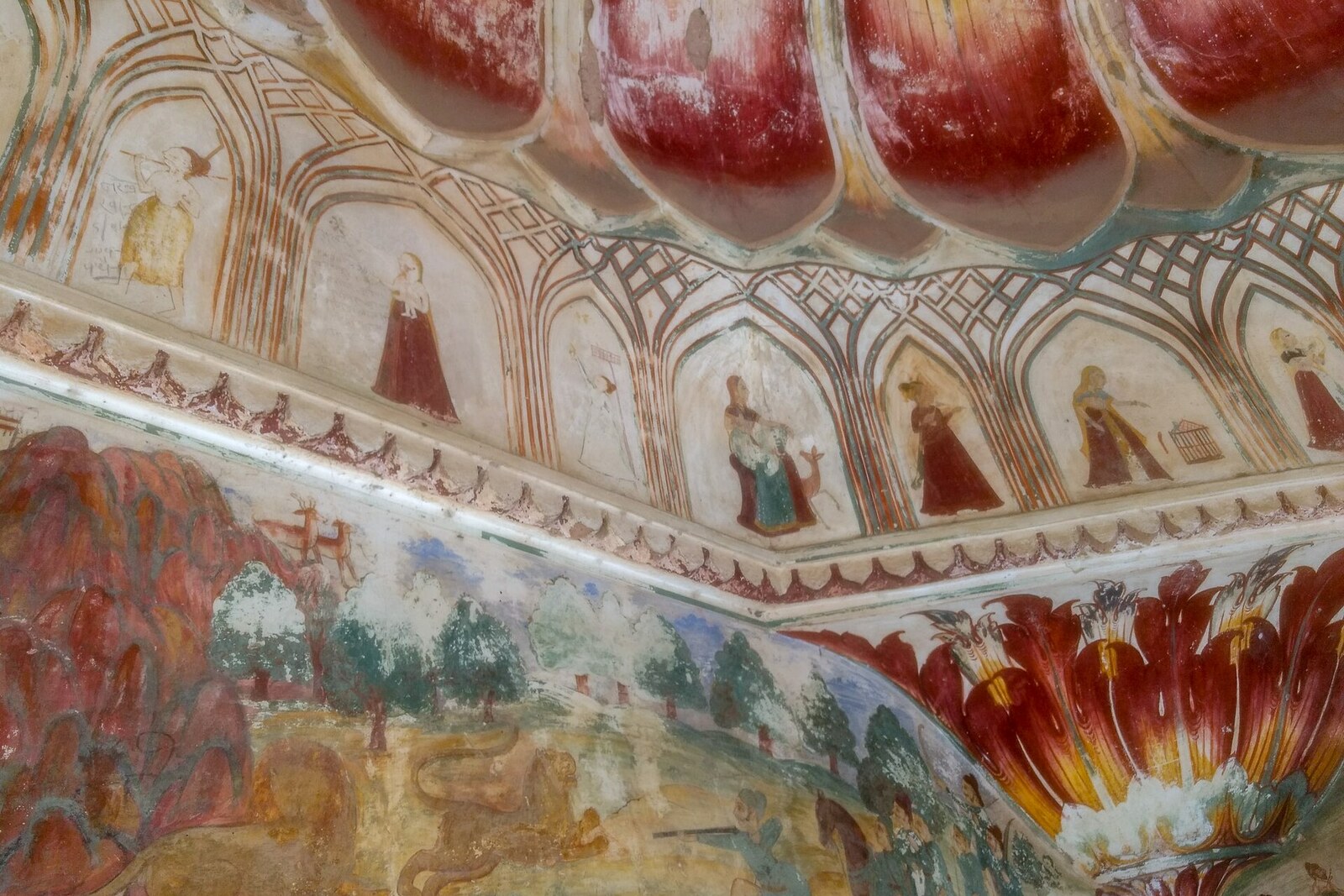 The emerald pool of Galta Kund beneath arcades