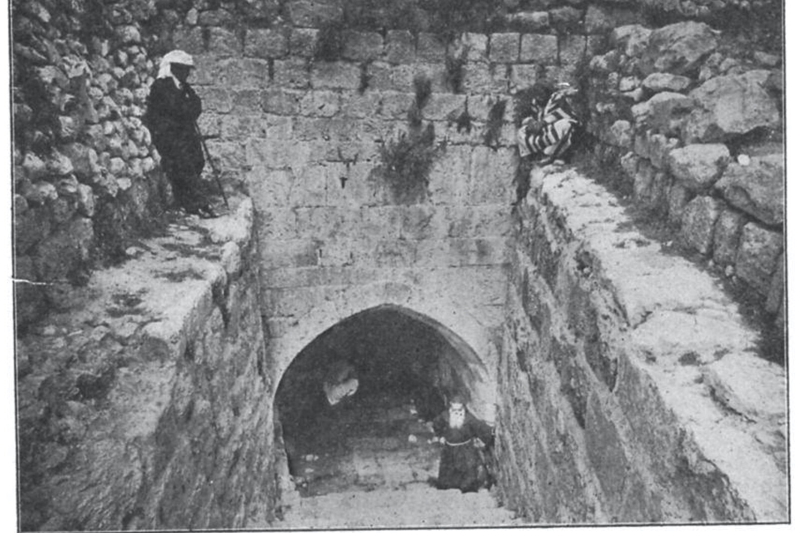 historic photograph of Gihon Spring, also known as Gihon Spring, with people drawing water