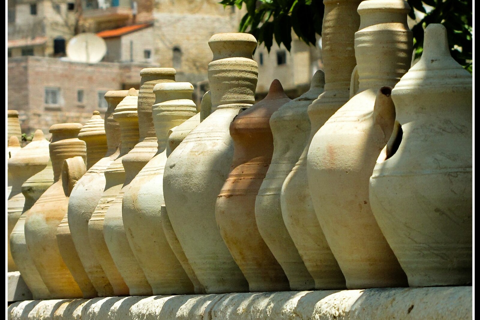 fragments of pottery lying on stone slabs beside the Pool of Siloam