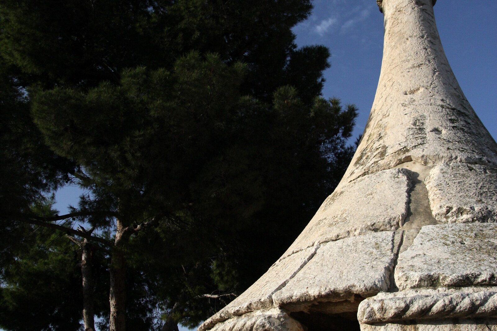 The monolithic monument of Absalom's Pillar, with a pyramidal roof and carved columns in the Kidron Valley