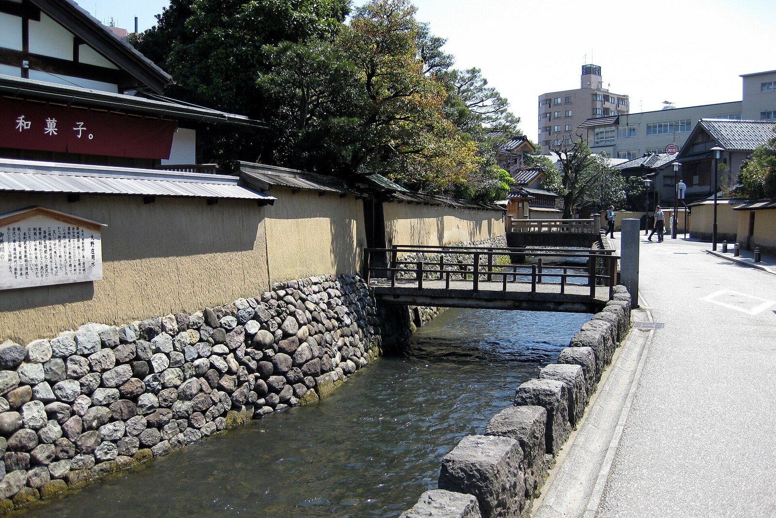 The Onosho Canal in the Nagamachi Samurai District, with stone-lined edges and houses beside it.
