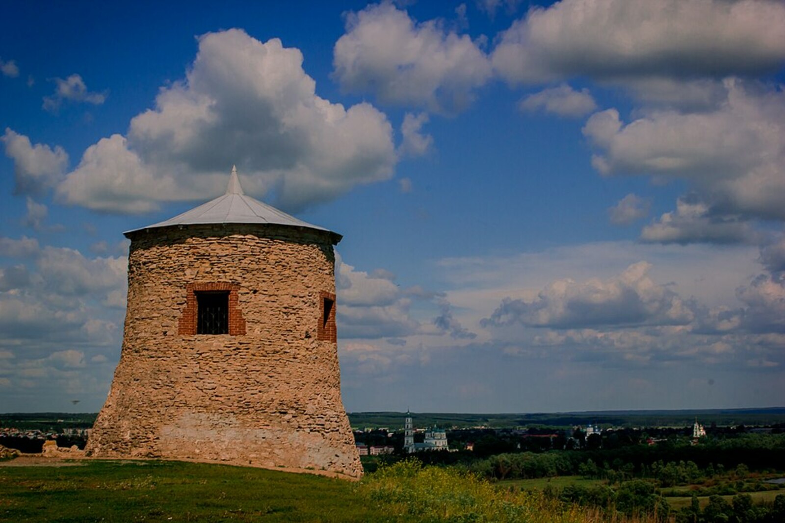 White round tower of Yelabuga Hillfort on a grassy promontory