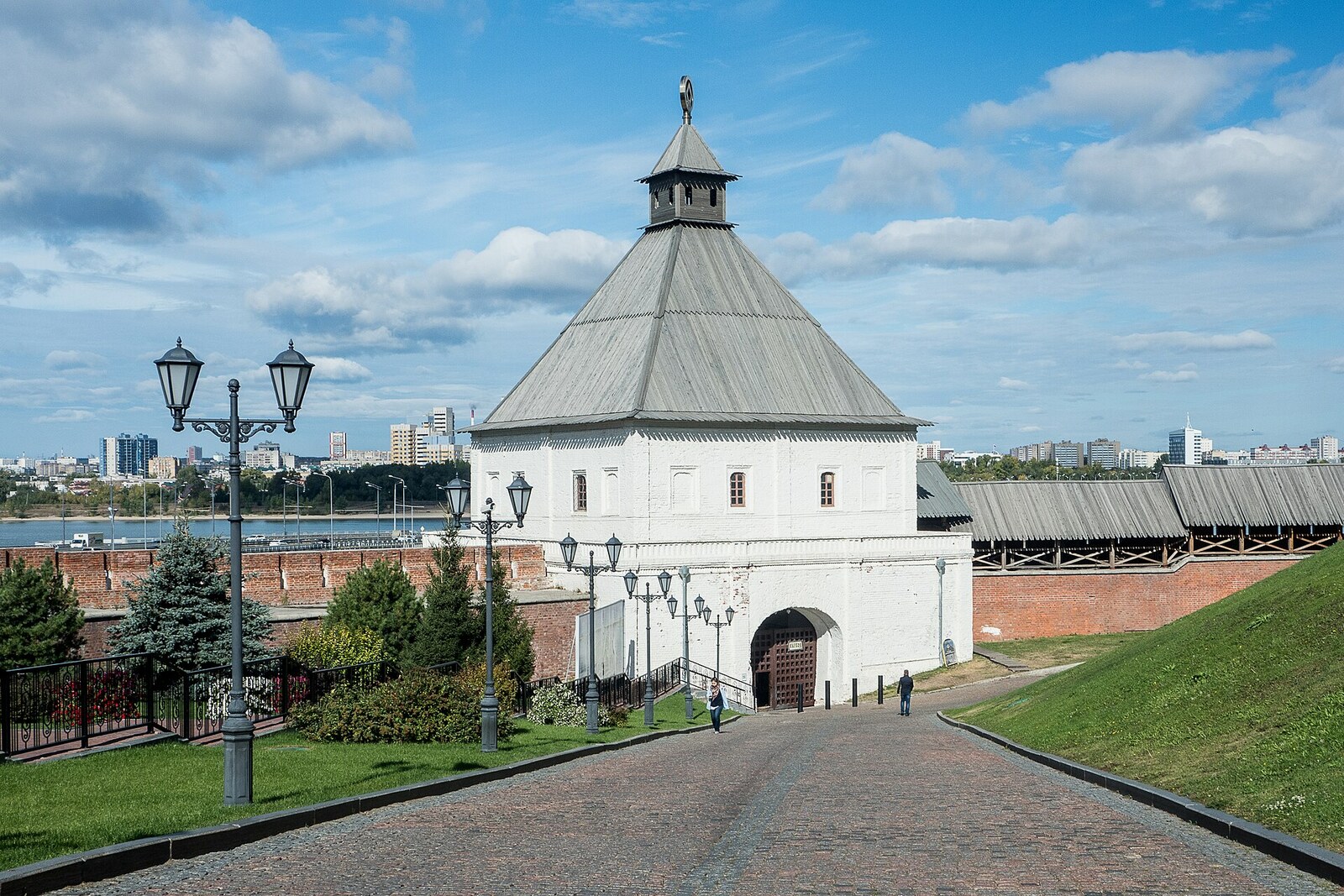 Taynitskaya Tower and the white fortress wall of the Kazan Kremlin.