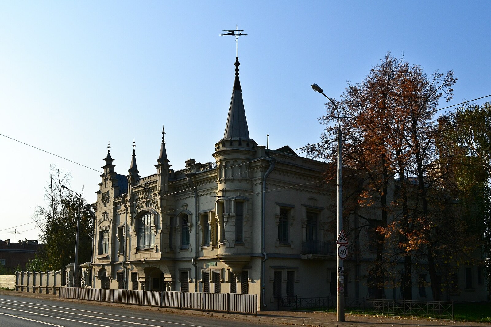 House of Shamil in Kazan: a light-colored facade with a round tower and a crenellated parapet.