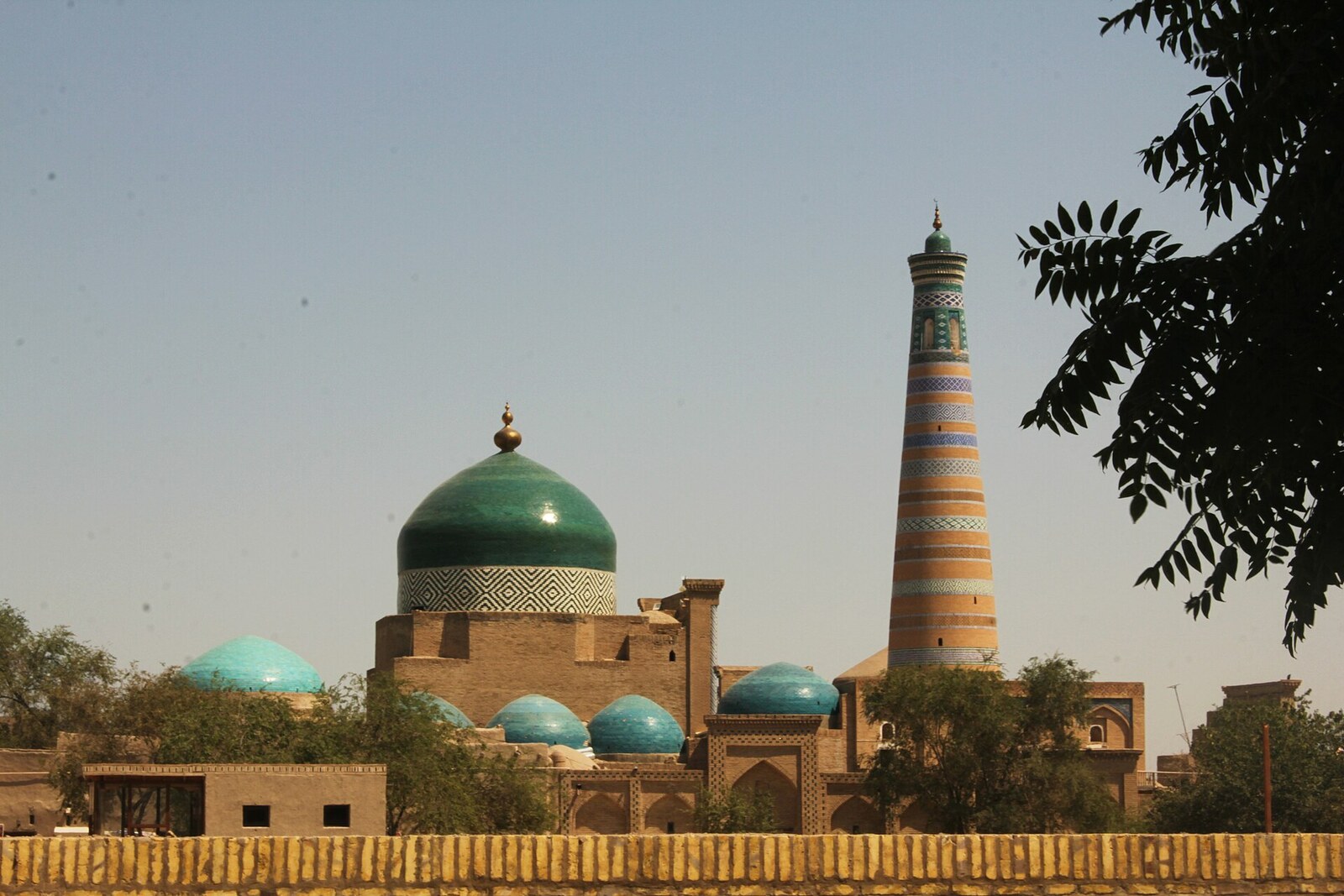 Pahlavan Mahmud Mausoleum with a large turquoise dome above a cramped courtyard.
