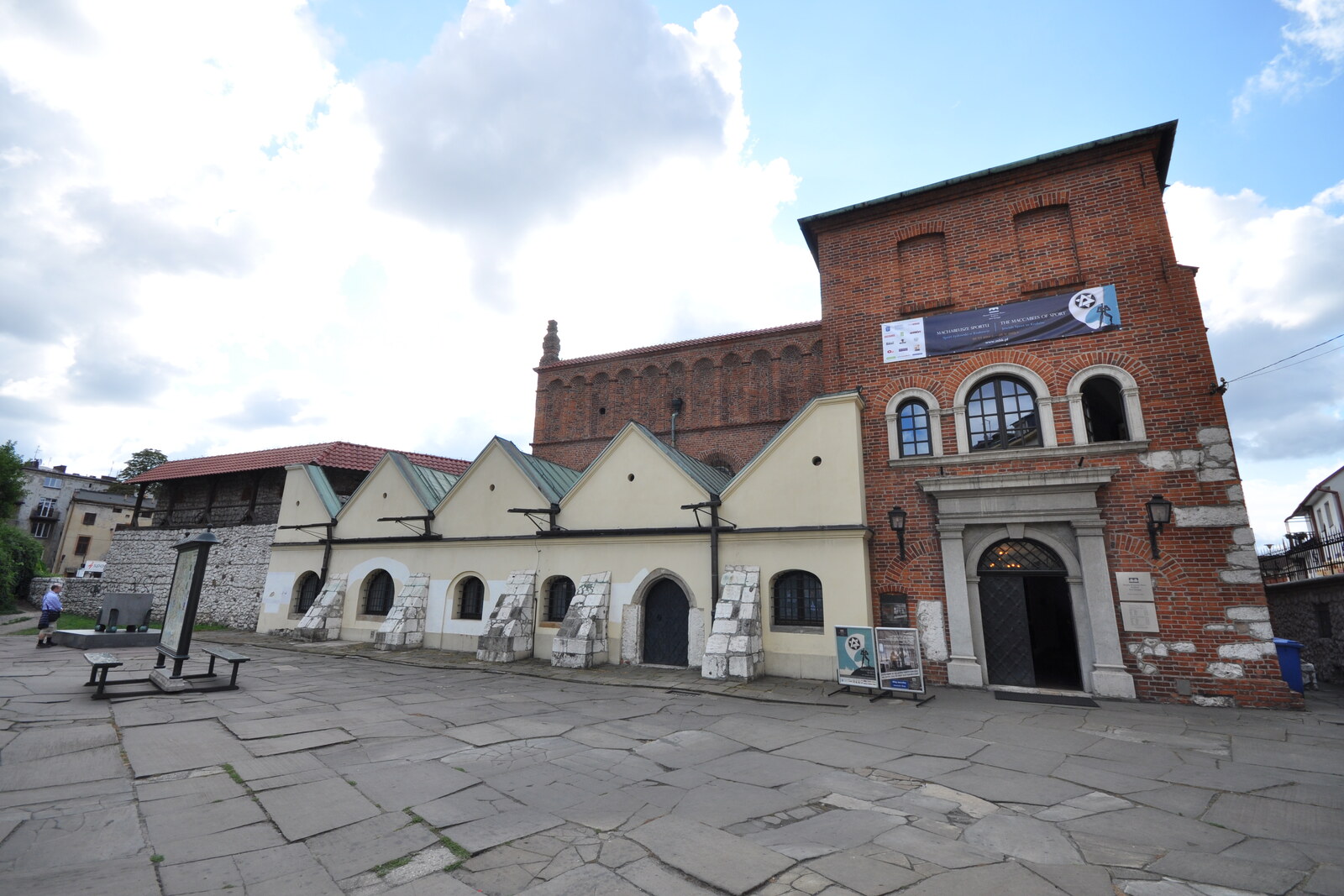 The red-brick Old Synagogue with crenellations and small windows