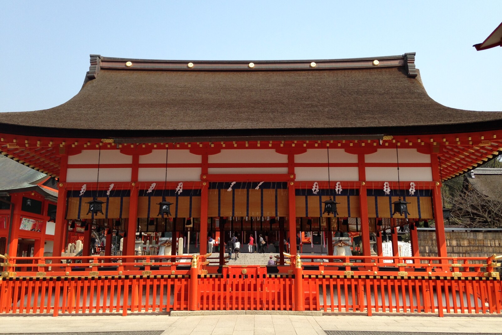 The Main Hall of Fushimi Inari Taisha with red wooden architecture