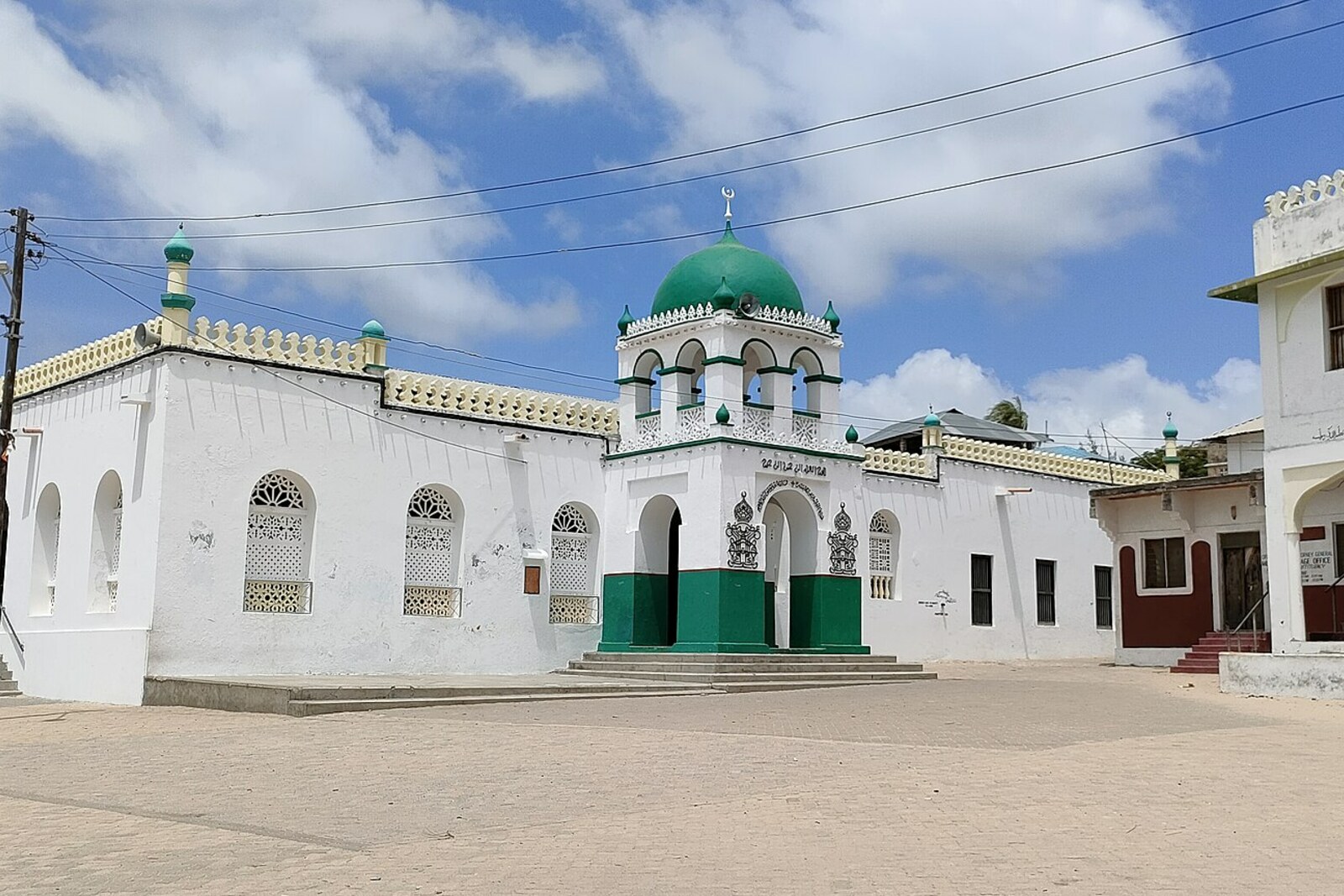 The green-and-white facade of the Riyadha Mosque and Islamic Centre in Lamu.