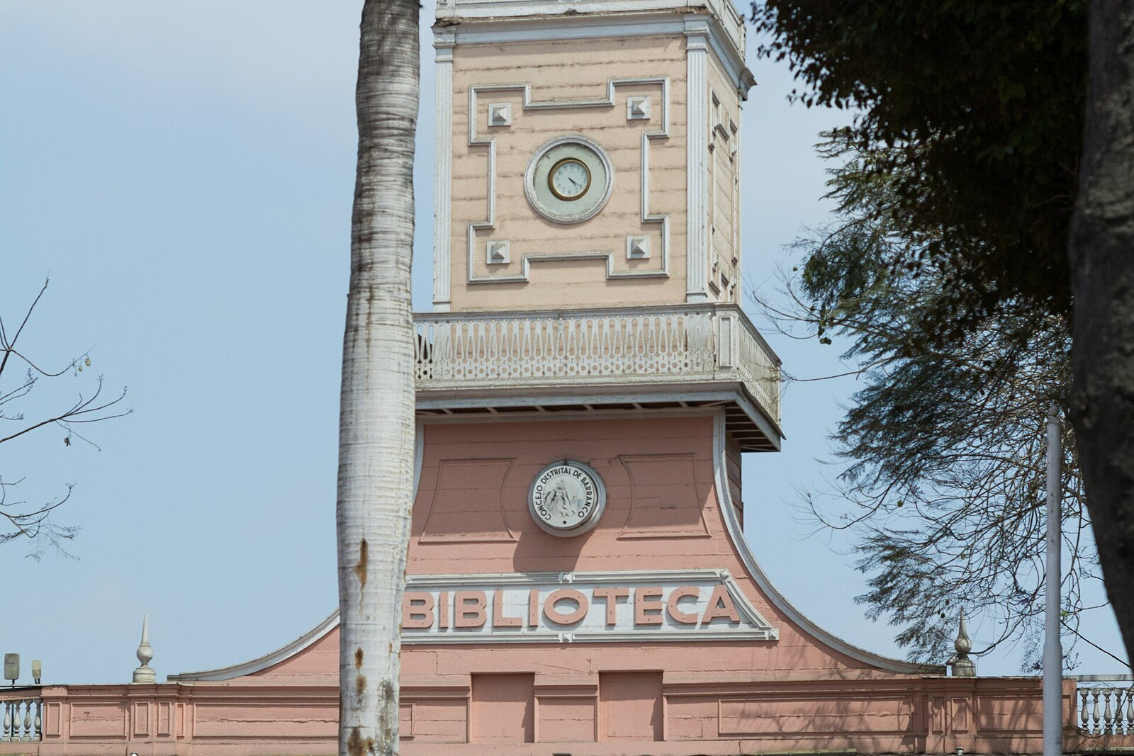 White neoclassical municipal library building against a blue sky