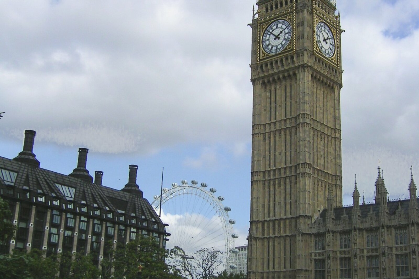 The London Eye and Big Ben against a blue sky