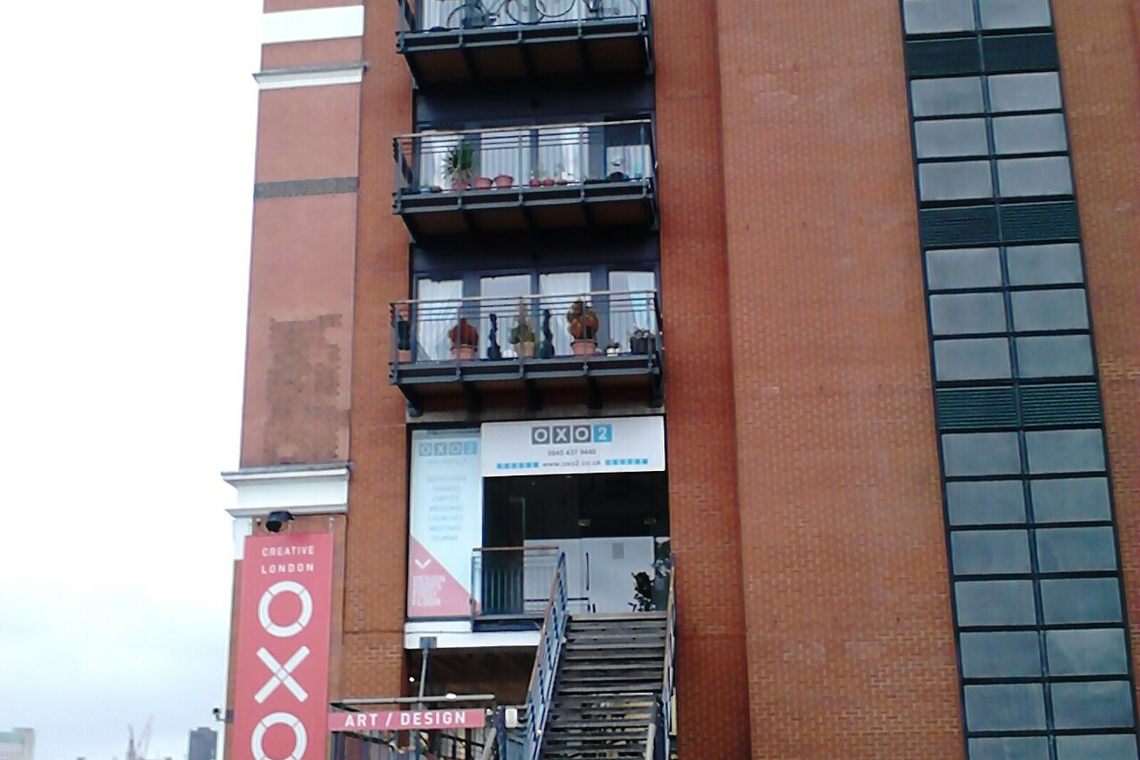 OXO Tower with the letters O-X-O and brick buildings along the waterfront