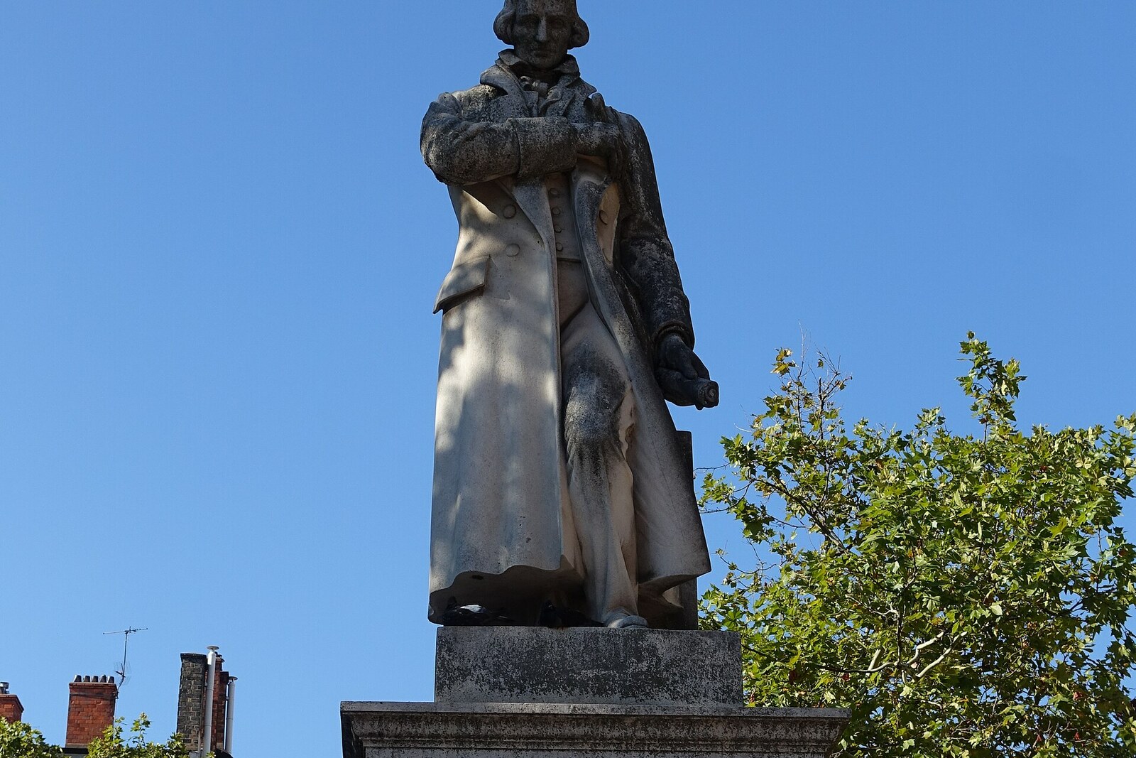 Stone statue of Joseph-Marie Jacquard in the center of Place de la Croix-Rousse.