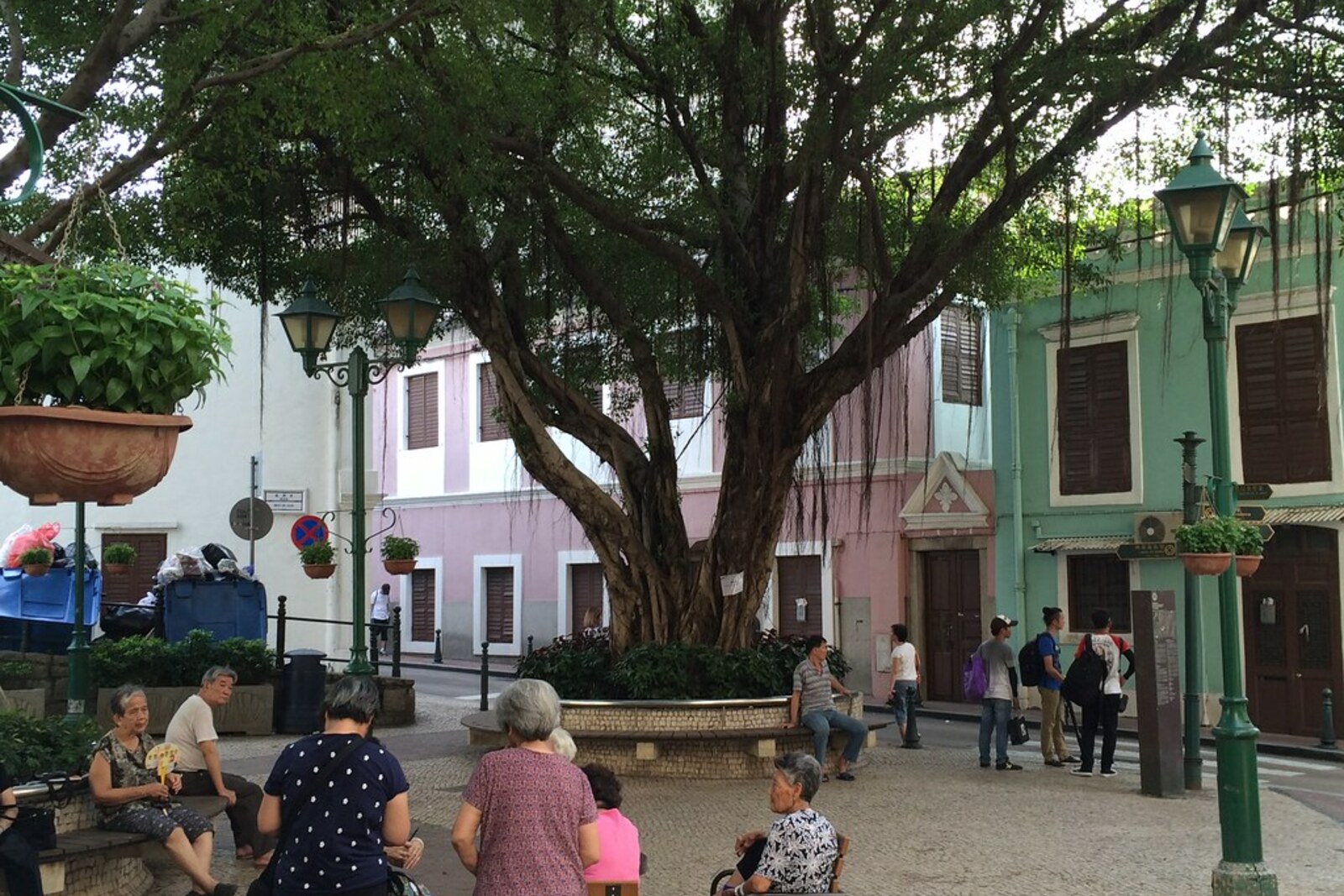 Lilau Square in Macau, with a tree, benches, and Portuguese stone paving.