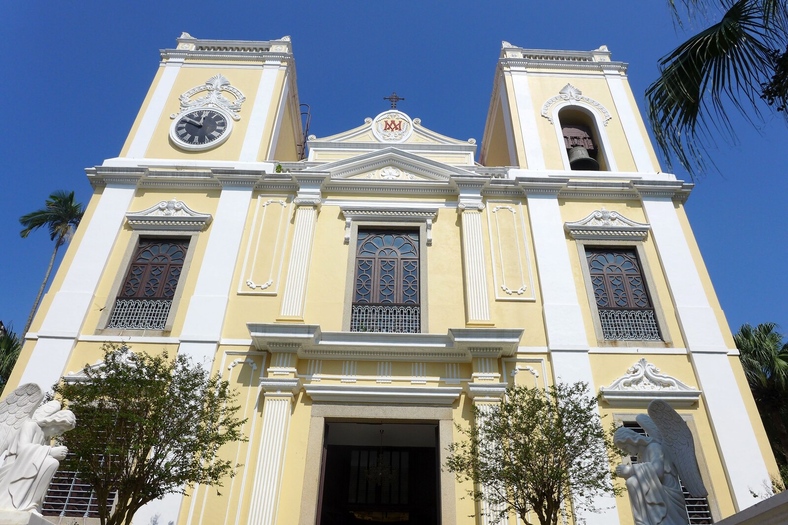 Facade of St. Lawrence's Church in Macau, viewed from below, with its light Baroque wall.