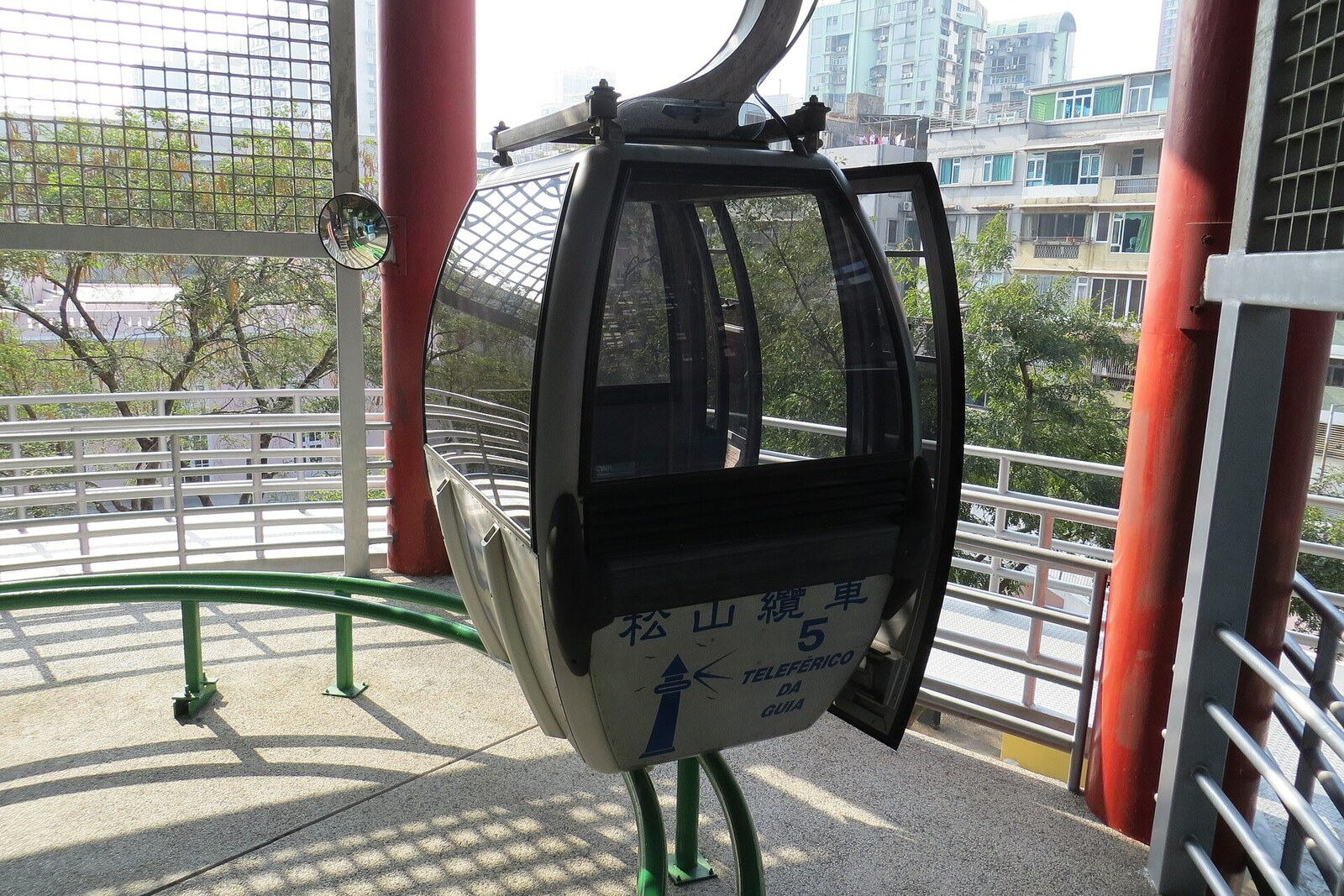 A Guia Cable Car cabin gliding above the park’s trees