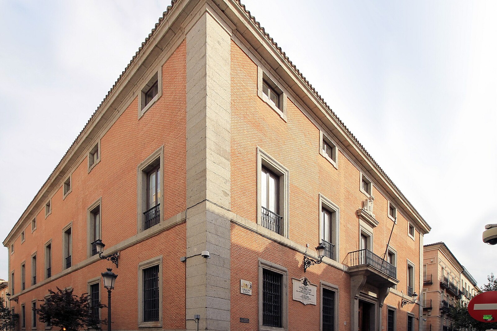 Solid neoclassical façade of the Royal Academy of History (Casa del Nuevo Rezado) in Madrid.