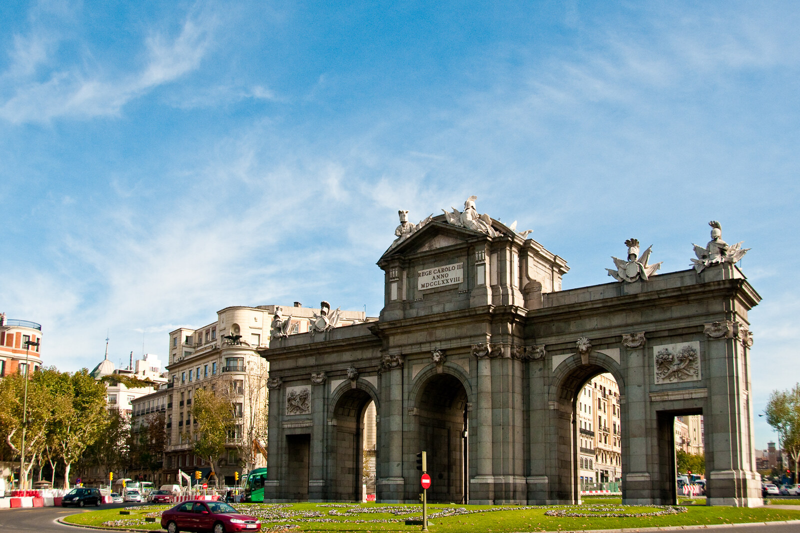 Western façade of Puerta de Alcalá, a granite triumphal arch in Madrid
