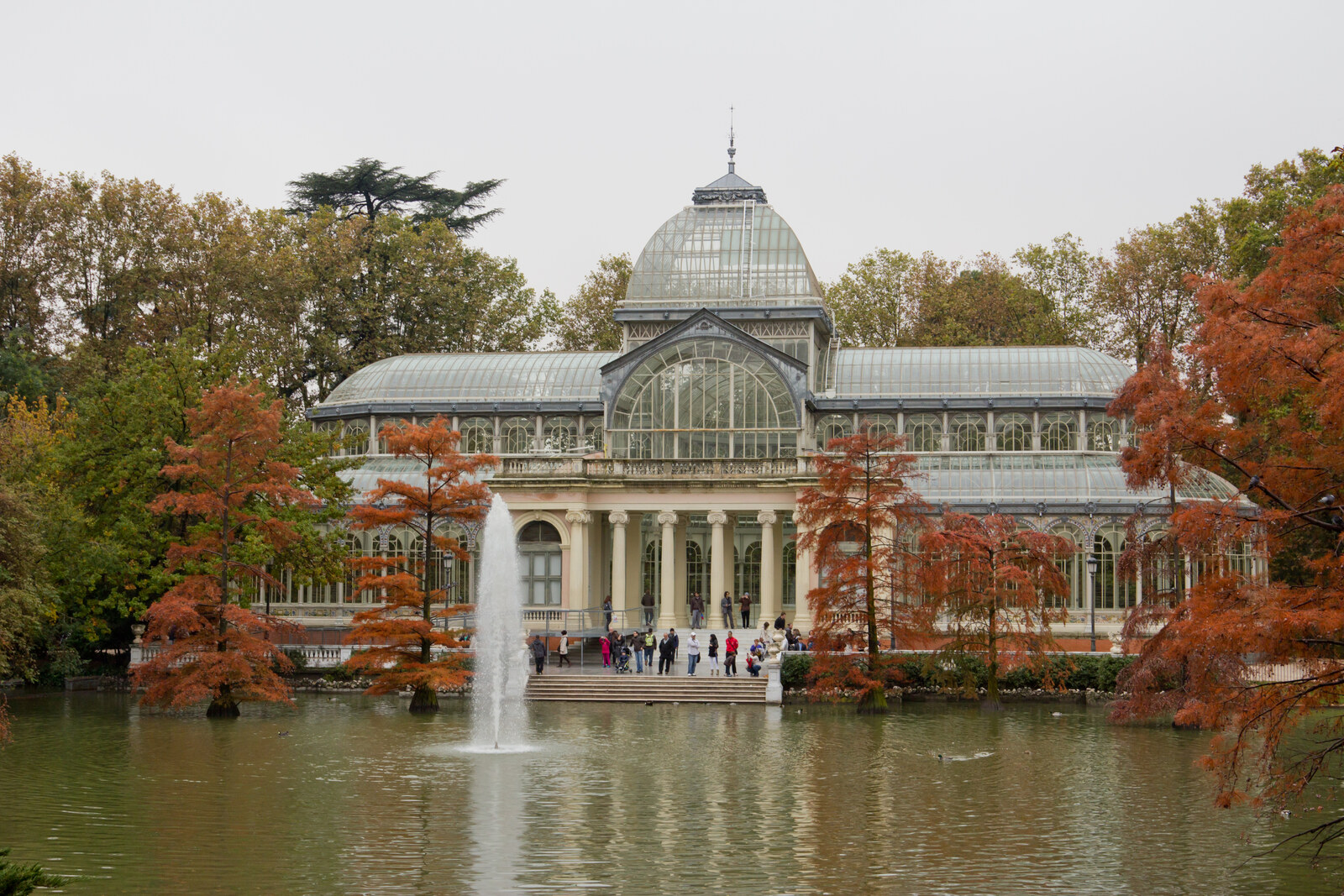 Glass Palace in El Retiro Park reflected in the pond