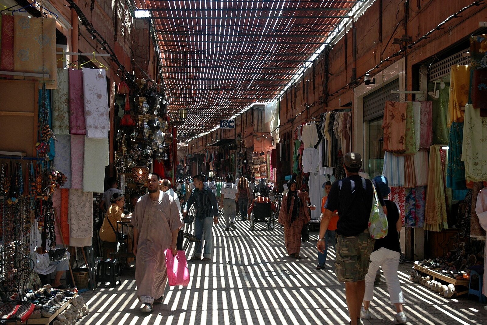 The covered passage of Souk Semmarine, with bands of light coming through the roof.