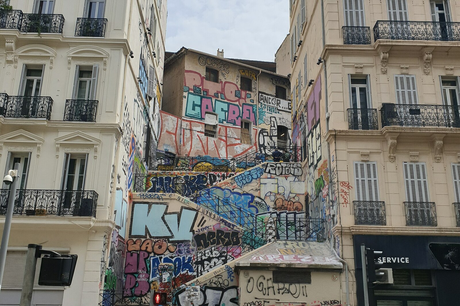 Colorful graffiti-covered steps on the Cours Julien staircase