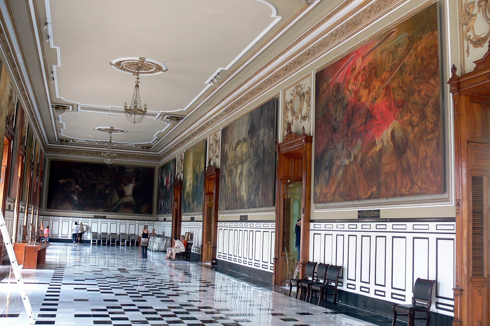 A hall in the Palacio de Gobierno with monumental murals.