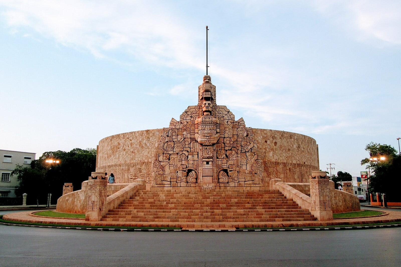 Monumento a la Patria with a stone arch, columns, and reliefs.
